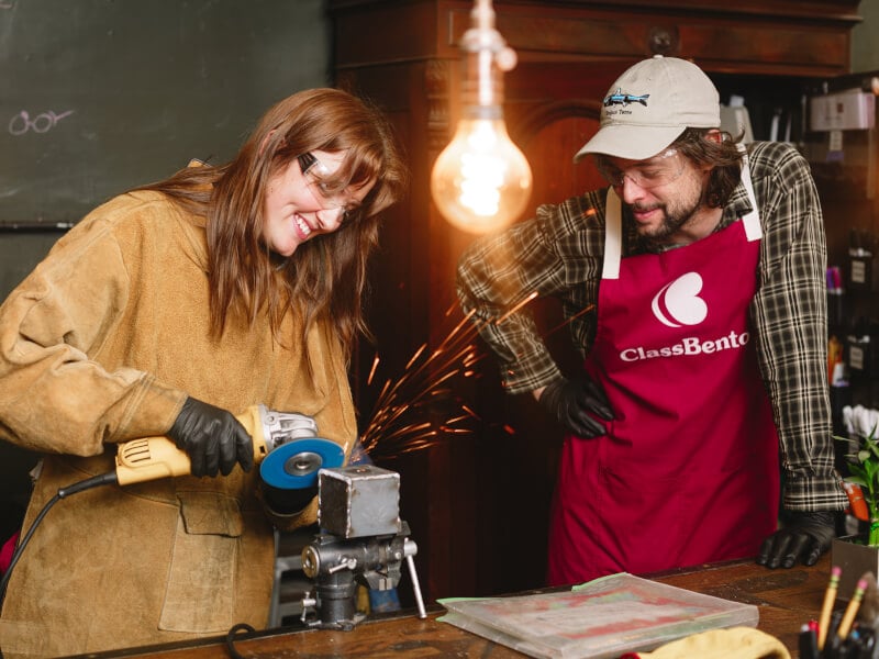 People making a DIY metal planter box